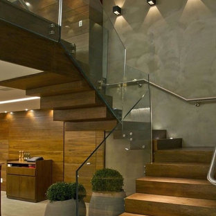 Idee per una grande scala sospesa contemporanea con pedata in legno e alzata in legno