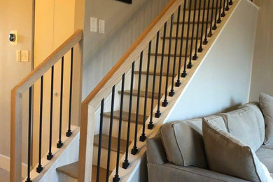 Example of a mid-sized minimalist wooden straight mixed material railing staircase design in New York with wooden risers