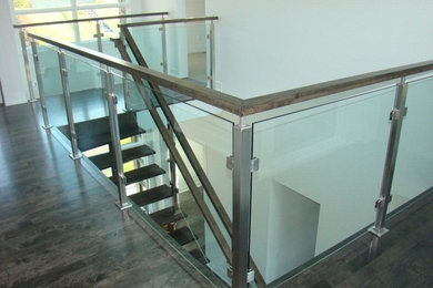 Staircase - contemporary staircase idea in Calgary