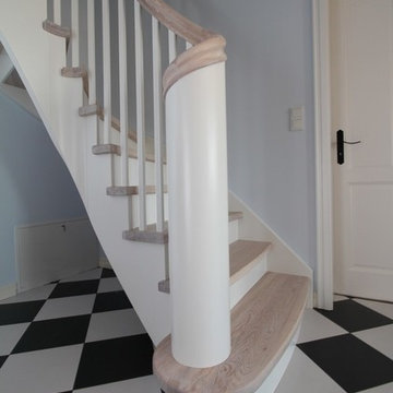 Stairs from artistic painted white ash and birch RAL9010
