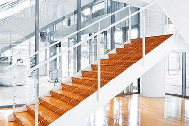 Example of a mid-sized minimalist wooden straight staircase design in New York with wooden risers
