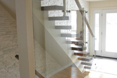 Staircase - mid-sized wooden straight staircase idea in Ottawa with painted risers