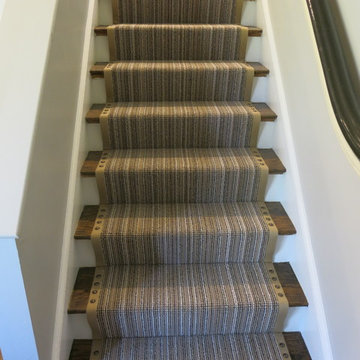 Stairway runner - Constrasting banding and large nailheads make for a stylish st