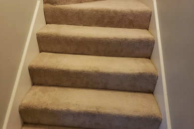 Example of a mid-sized classic carpeted l-shaped staircase design in Houston with carpeted risers