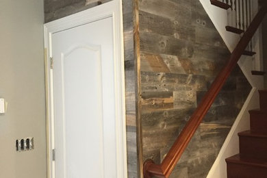 Example of a large classic wooden u-shaped wood railing staircase design in Boston with wooden risers