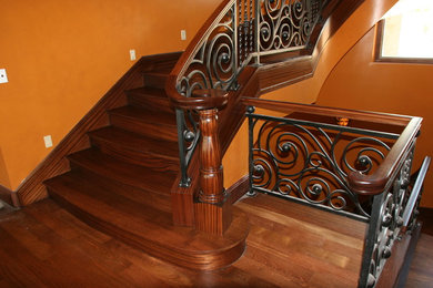 Inspiration for a modern wooden curved staircase remodel in Las Vegas with wooden risers