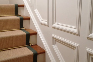 Mid-sized elegant wooden straight staircase photo in Charleston with painted risers