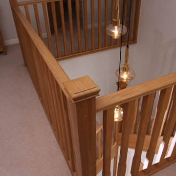 Stop chamfered oak spindles with pendant lighting