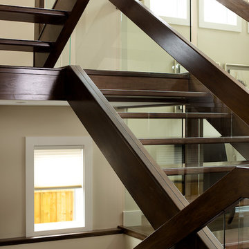 Straight maple stair with glass panel railing
