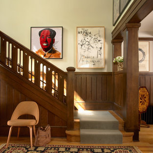 Arts and crafts wooden l-shaped staircase photo in Minneapolis with wooden risers