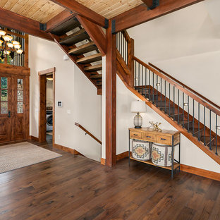 Mountain style wooden l-shaped wood railing staircase photo in Seattle with wooden risers