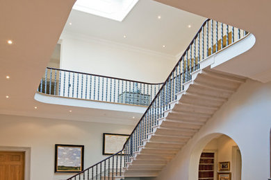 Design ideas for a mediterranean l-shaped staircase in Hampshire with feature lighting.