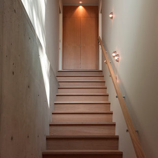 Staircase - mid-sized modern wooden straight wood railing staircase idea in Austin with wooden risers