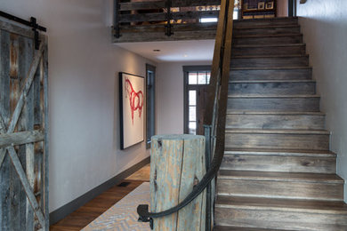 Inspiration for a rustic straight staircase remodel in Other