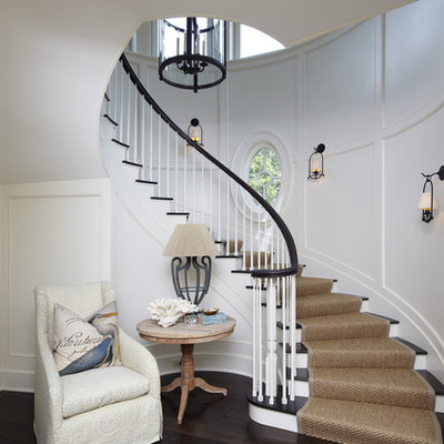 Inspiration for a coastal wooden curved staircase remodel in Charleston with painted risers