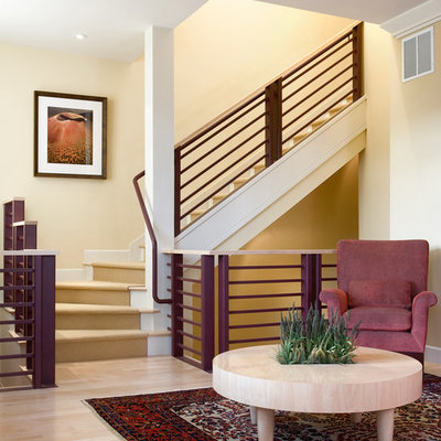 Example of a transitional wooden l-shaped staircase design in Denver with painted risers