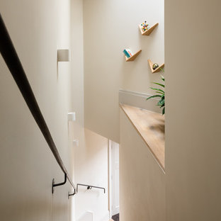 Inspiration for a scandinavian wood metal railing staircase in London.