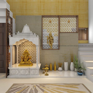 The intricately designed Ganesh idol made of clay is placed inside the mandap.