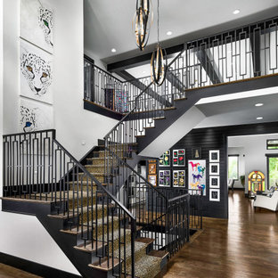 Inspiration for a contemporary wooden u-shaped metal railing staircase remodel in Denver with painted risers