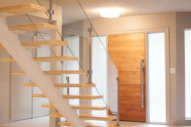 Mid-sized minimalist wooden straight open staircase photo in Houston