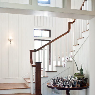 Island style wooden staircase photo in Miami