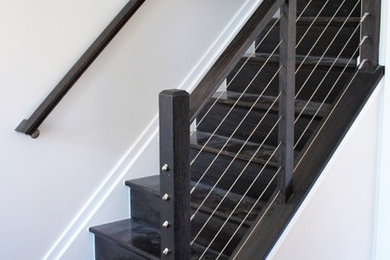 Mid-sized trendy wooden straight mixed material railing staircase photo in Baltimore with wooden risers