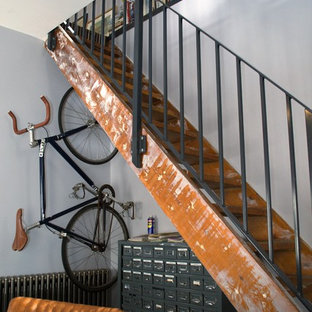 Inspiration for a small urban wood straight metal railing staircase in Other with open risers.