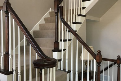 Example of a small classic u-shaped wood railing staircase design in Minneapolis