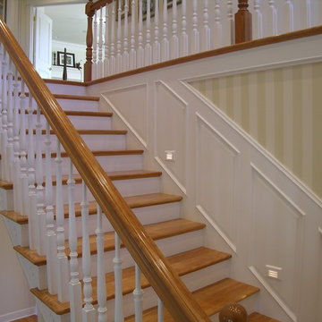Traditional stair with painted wainscoting