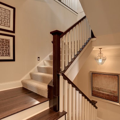 Elegant wooden staircase photo in Minneapolis