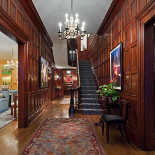 This is an example of a victorian wood u-shaped staircase in Other.