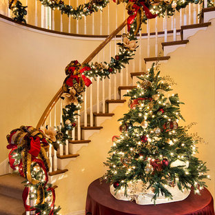 Inspiration for a large timeless wooden curved staircase remodel in San Francisco with painted risers