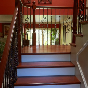 Traditional Staircase with Iron Balusters