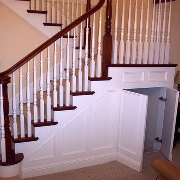 Traditional staircase with wainscoting