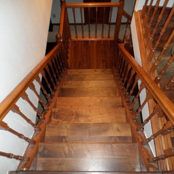 Traditional Staircase with Wood Spindles and Railing
