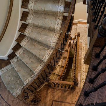 Traditional Wood and Iron Baluster Staircase Serves Three Floors