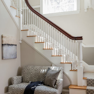 Inspiration for a transitional wooden l-shaped wood railing staircase remodel in Boston with wooden risers