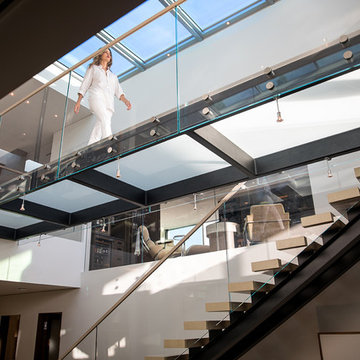Trousdale Beverly Hills luxury open volume home with modern glass bridge walkway