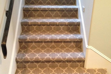 Mid-sized elegant carpeted l-shaped staircase photo in Orange County with carpeted risers