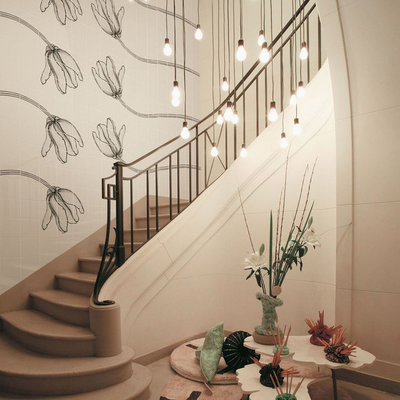 Example of an eclectic curved staircase design in Other