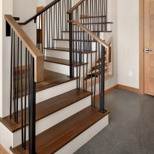 Example of a mid-sized mountain style wooden u-shaped metal railing staircase design in Seattle with wooden risers
