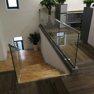 U-shape staircase with glass railing for office