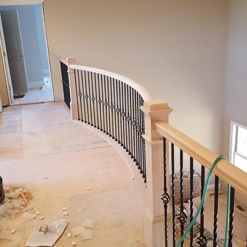 Unfinished Curved Rail and Iron Staircase and Balcony