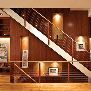 Staircase - contemporary wooden straight staircase idea in New York