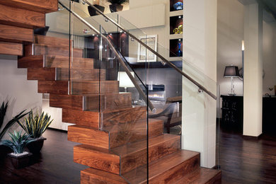 Inspiration for a mid-sized contemporary wooden floating glass railing staircase remodel in Denver with wooden risers