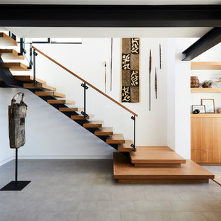 Staircase - contemporary wooden l-shaped open and glass railing staircase idea in Los Angeles