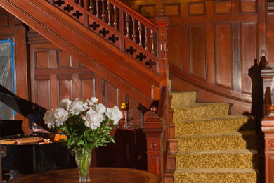 Large elegant carpeted l-shaped staircase photo in Boston with wooden risers