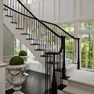 Design ideas for a victorian wood curved staircase in Boston with painted wood risers.