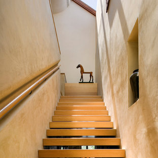 Inspiration for a mid-sized contemporary wooden l-shaped open staircase remodel in New York