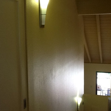 Wall sconces provide wall-washer and uplighting
